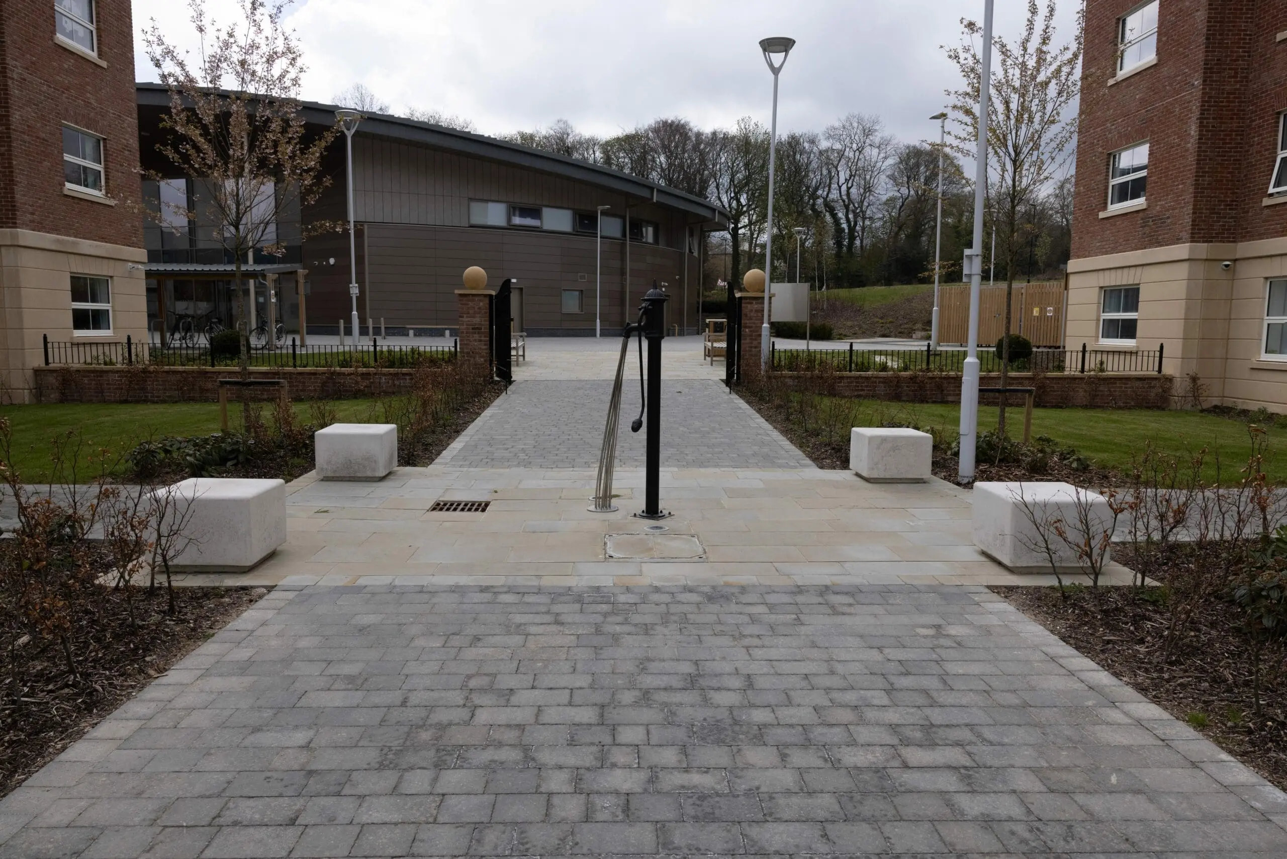 four square concrete seats around courtyard area