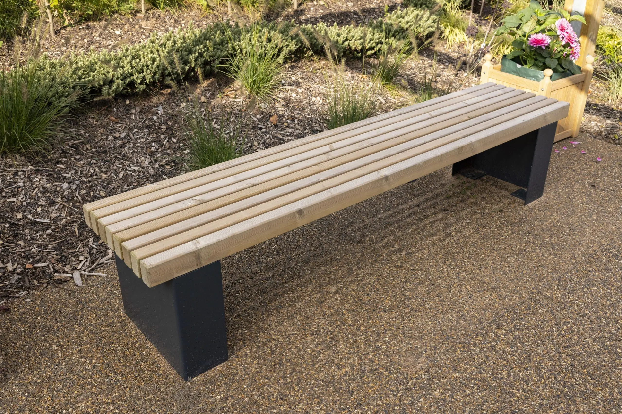 Wooden bench with black plinth legs