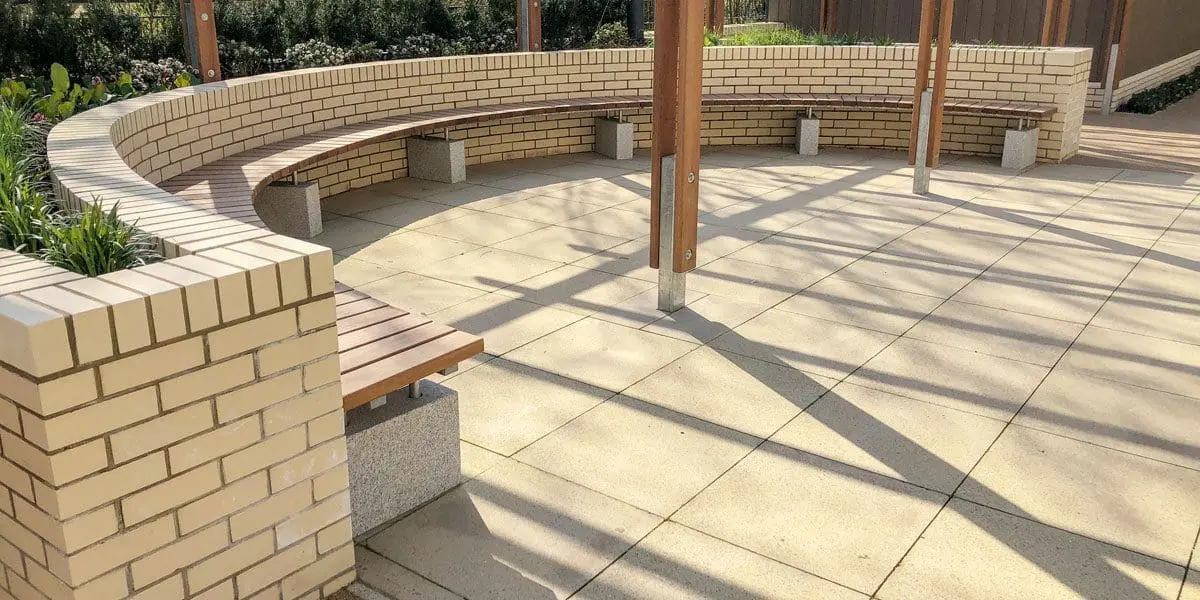 Curved wooden benches against curved wall