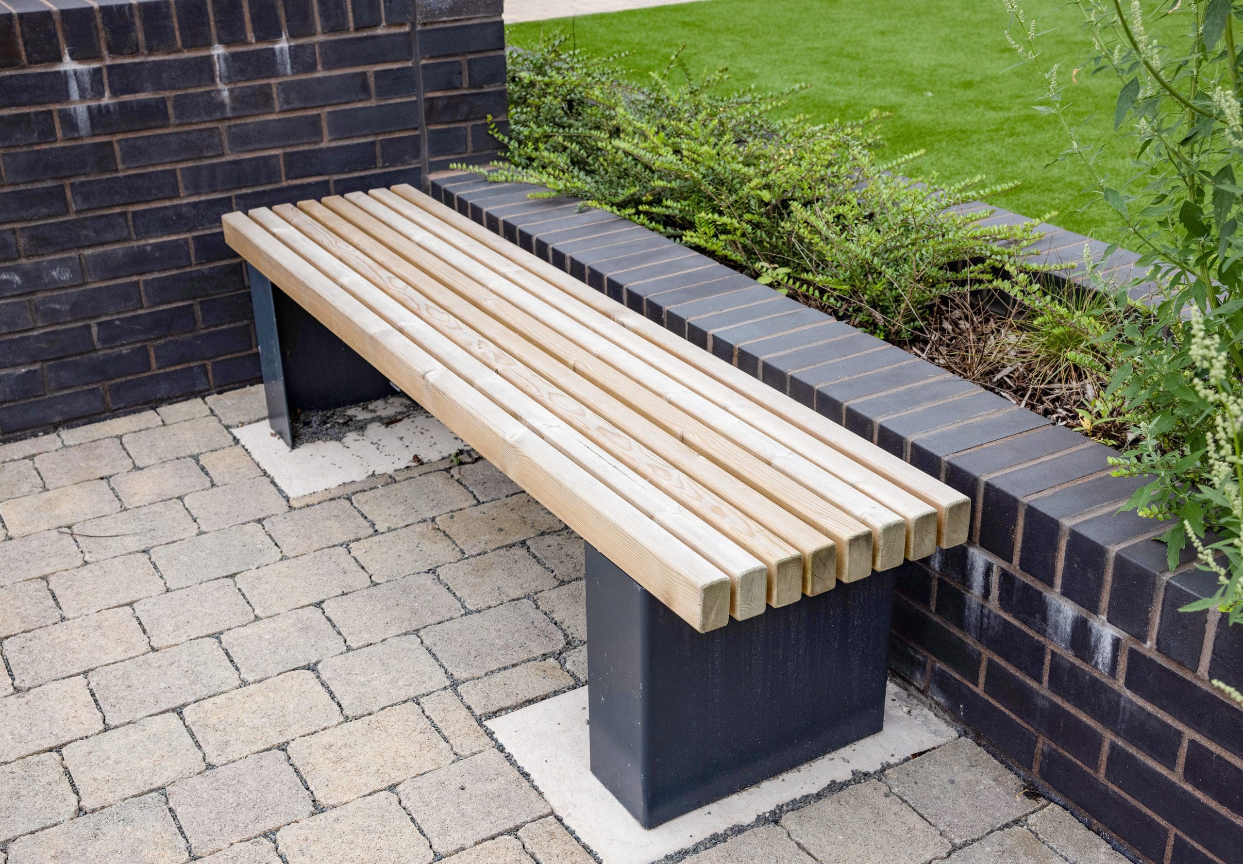 outdoor-wooden-bench-with-black-plinths