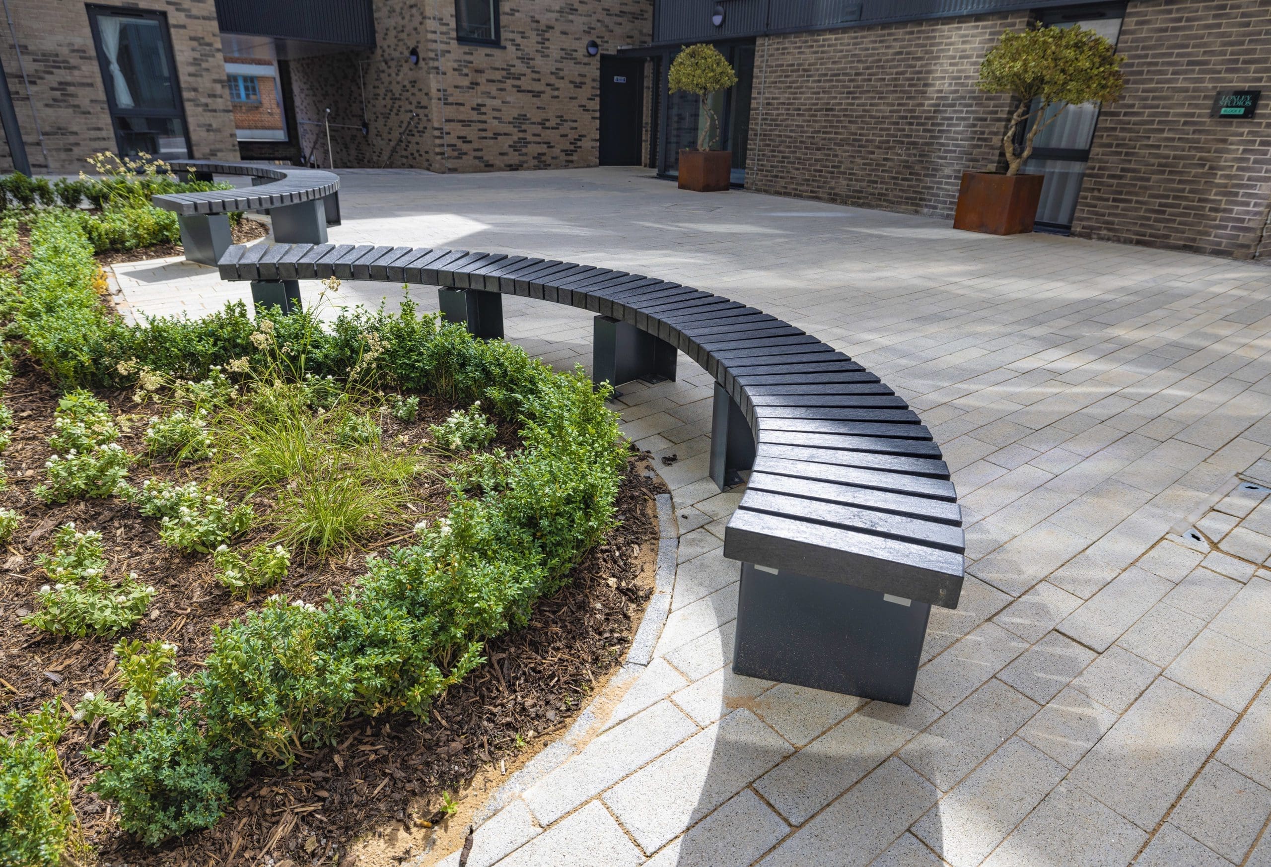 exterior-black-plastic-and-metal-curved-bench