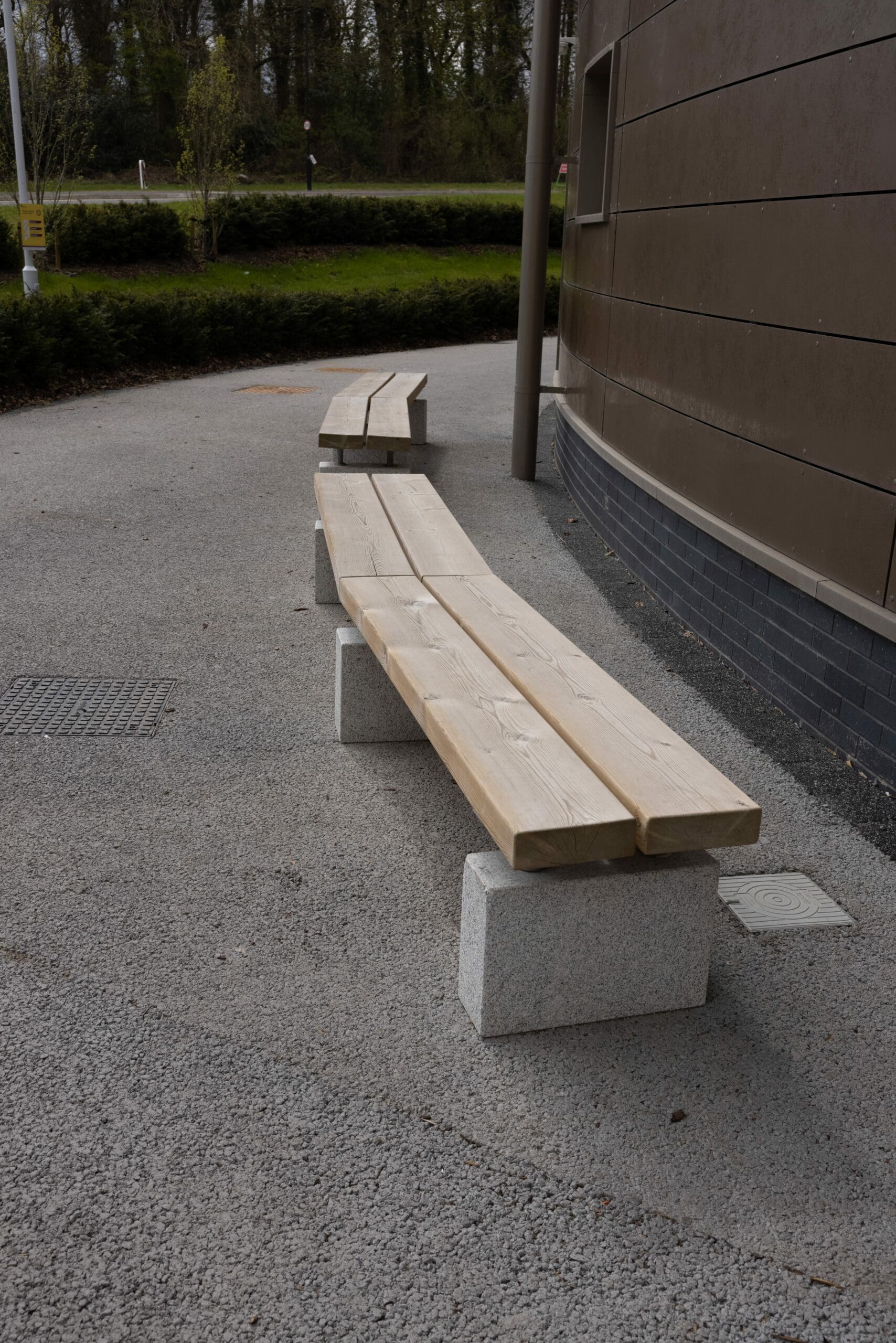outdoor wooden benches with concrete plinth legs