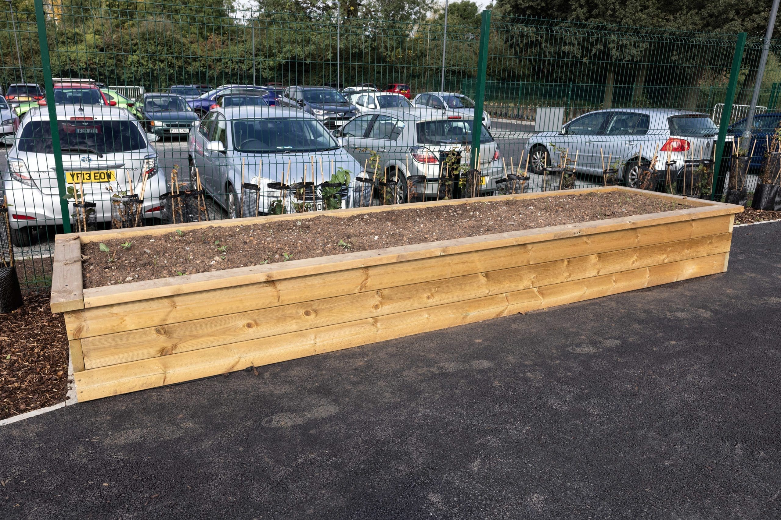 Large wooden rectangular raised bed planter