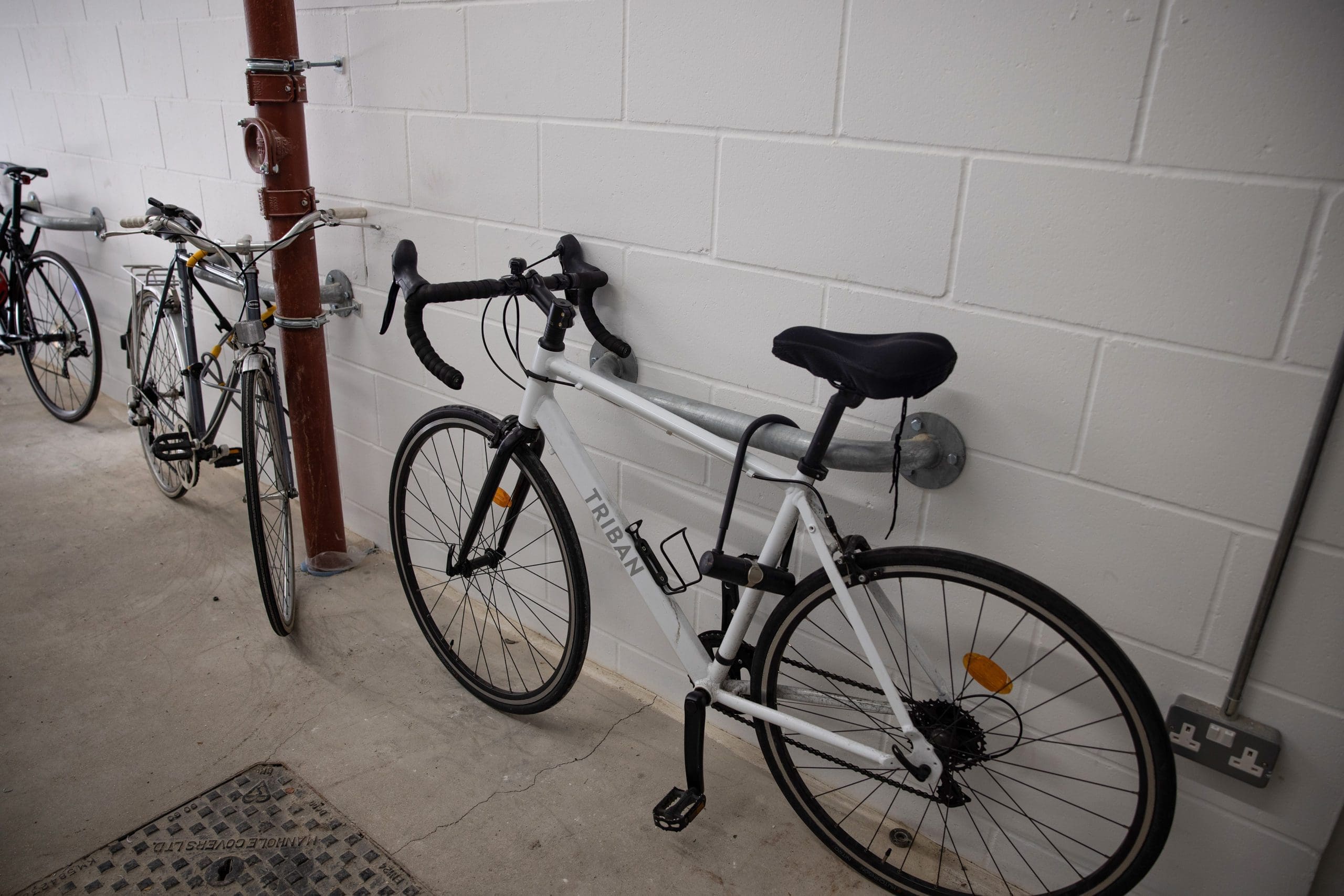 Wall mounted metal handle bike storage