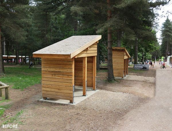 Small angled wooden outdoor canopy in the woods