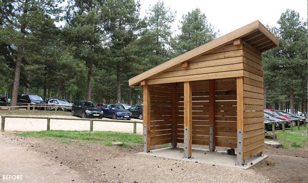 Small angled wooden outdoor canopy in the woods