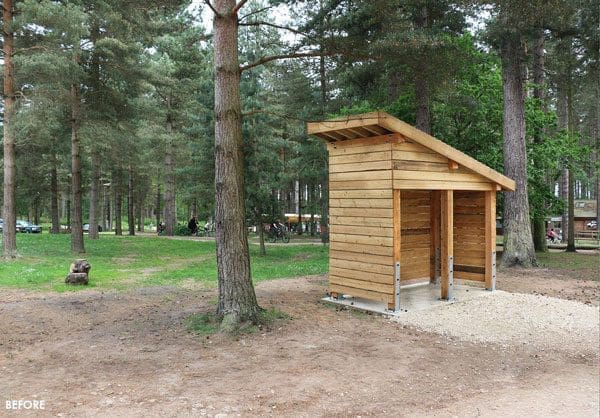 Small angled wooden outdoor canopy in the woods