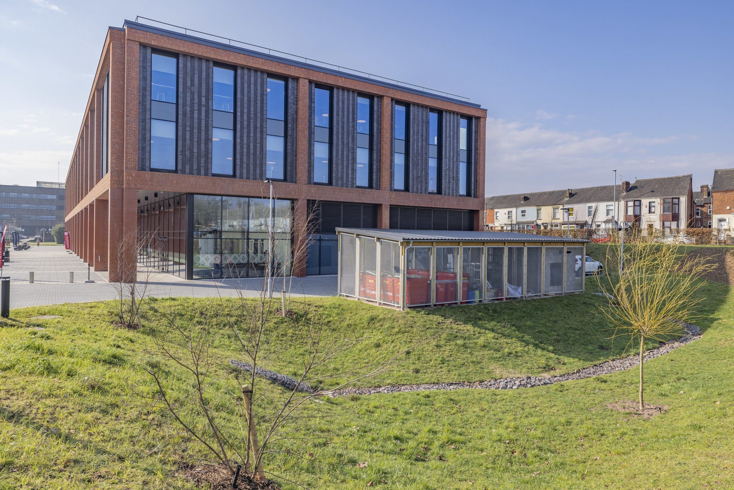 wide-shot-university-building-with-metal-external-storage-container