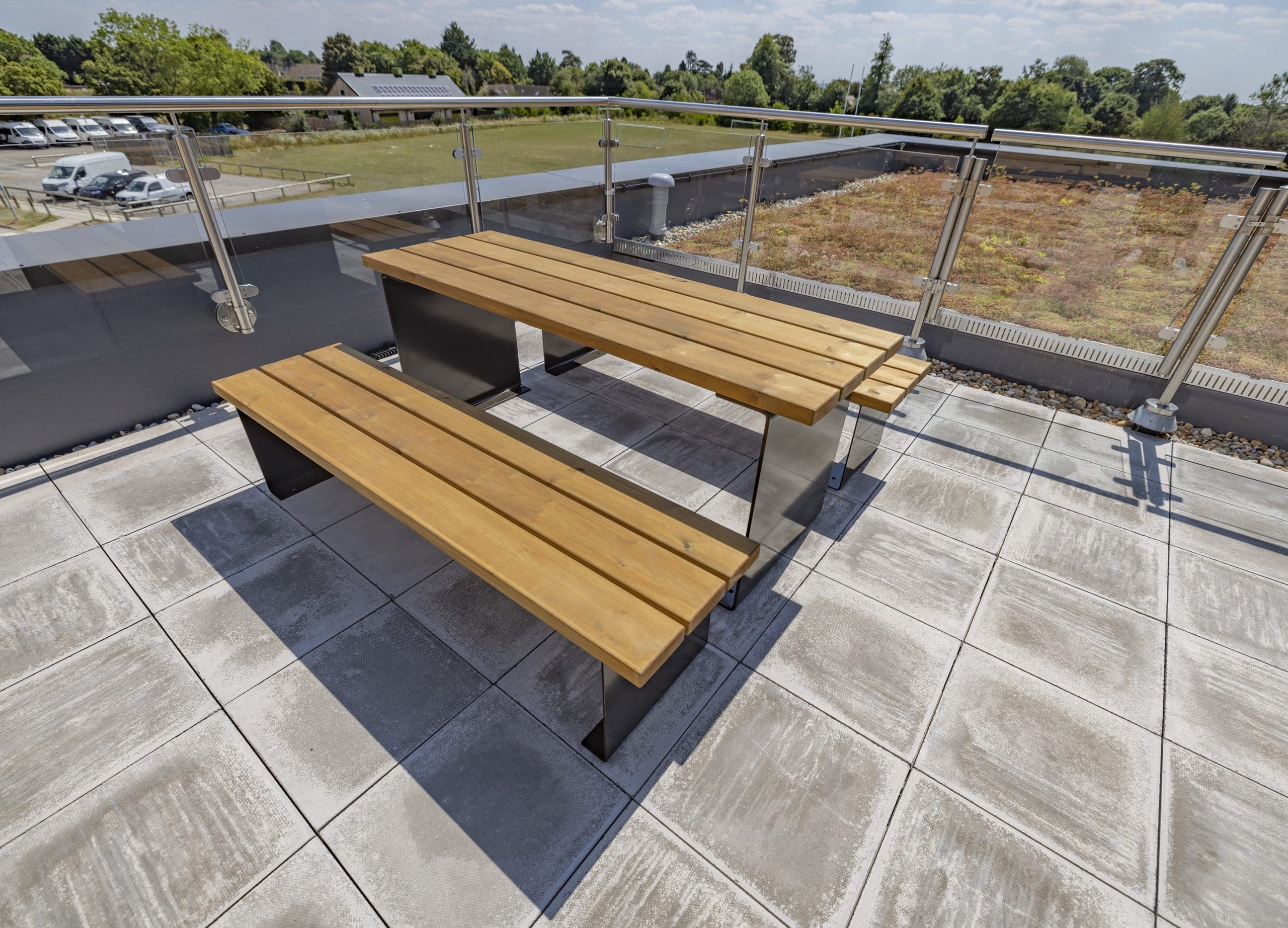 exterior-wooden-table-with-benches-black-metal-legs