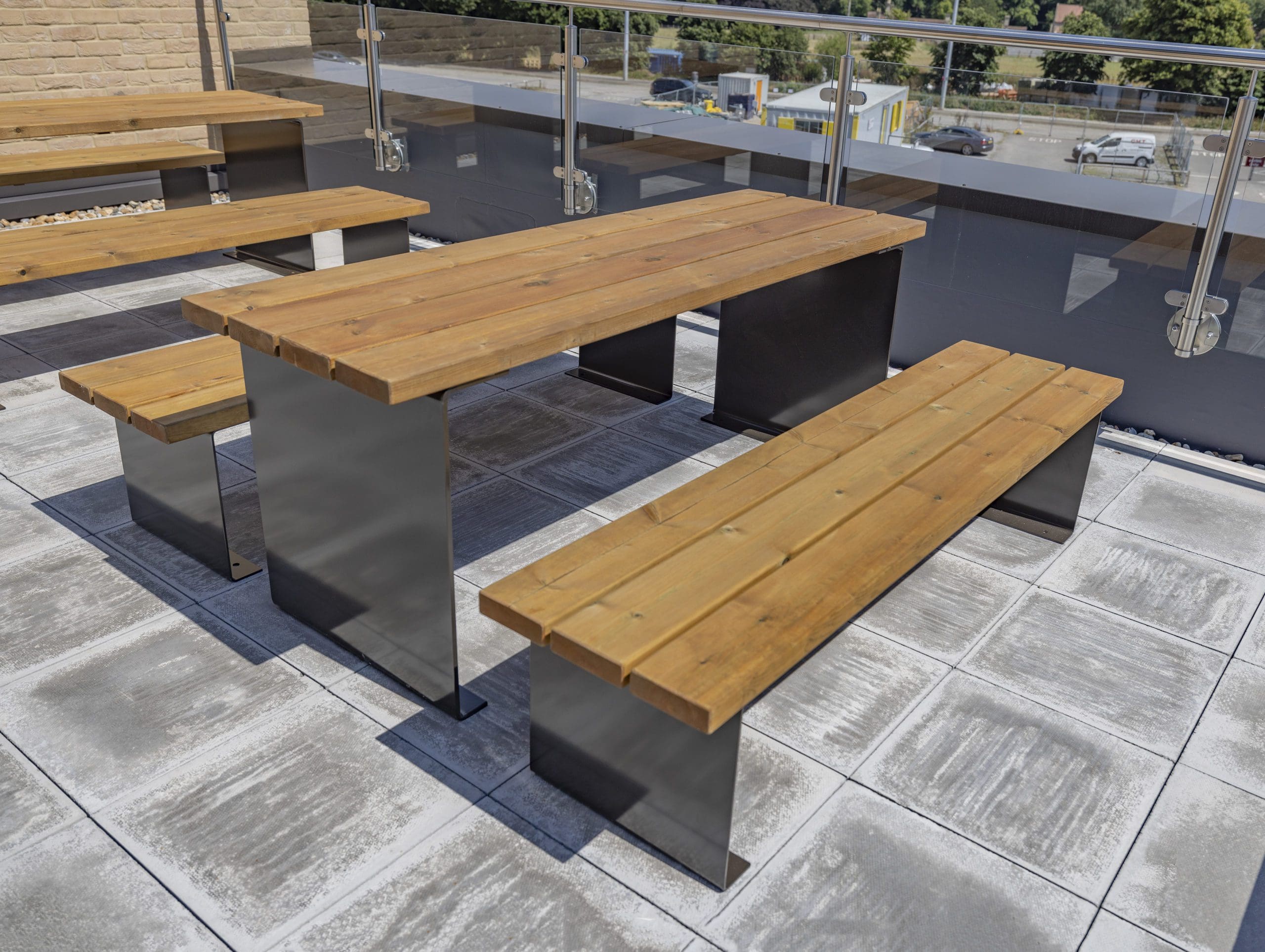 exterior-wooden-table-with-benches-black-metal-legs