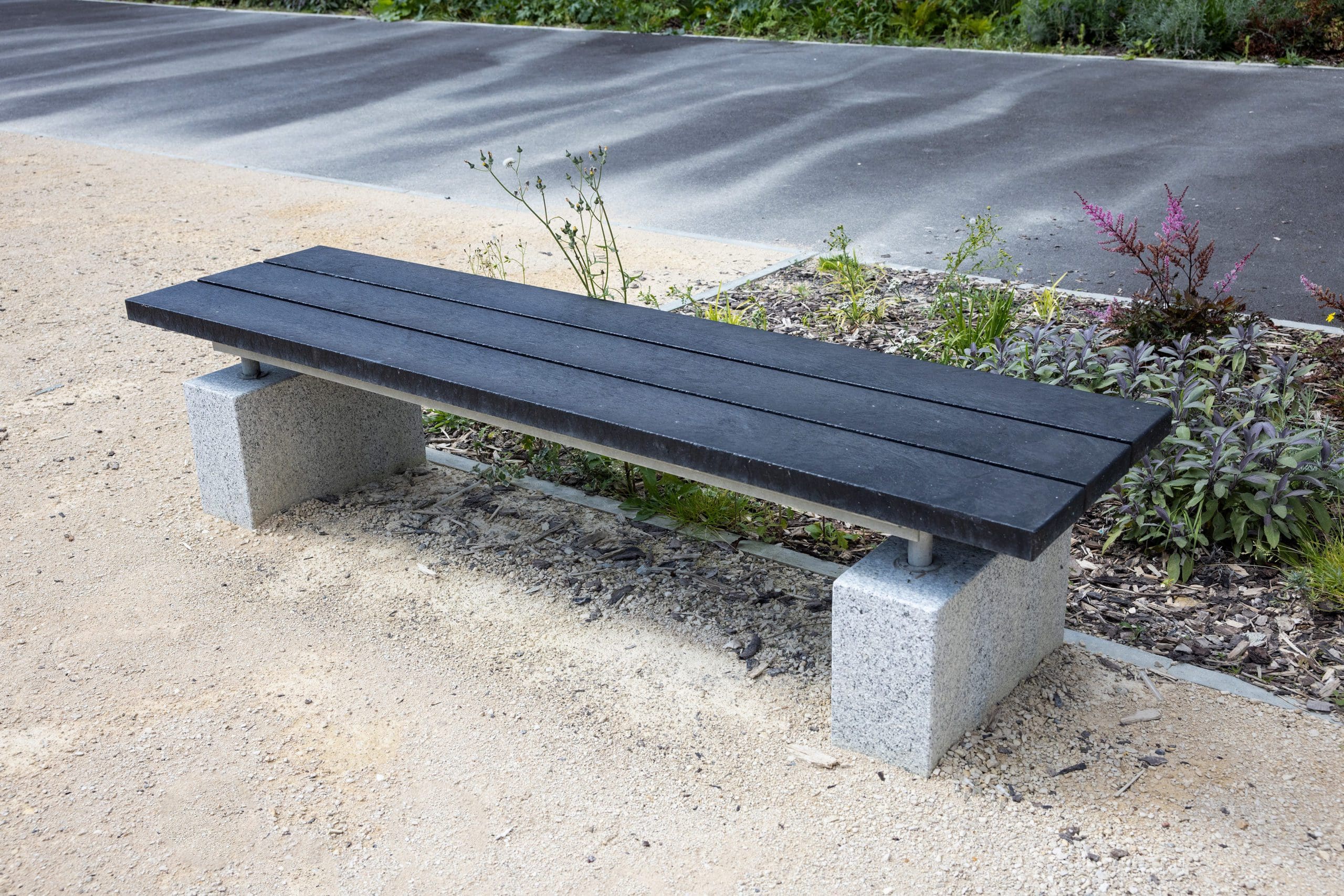 black wooden bench with concrete feet