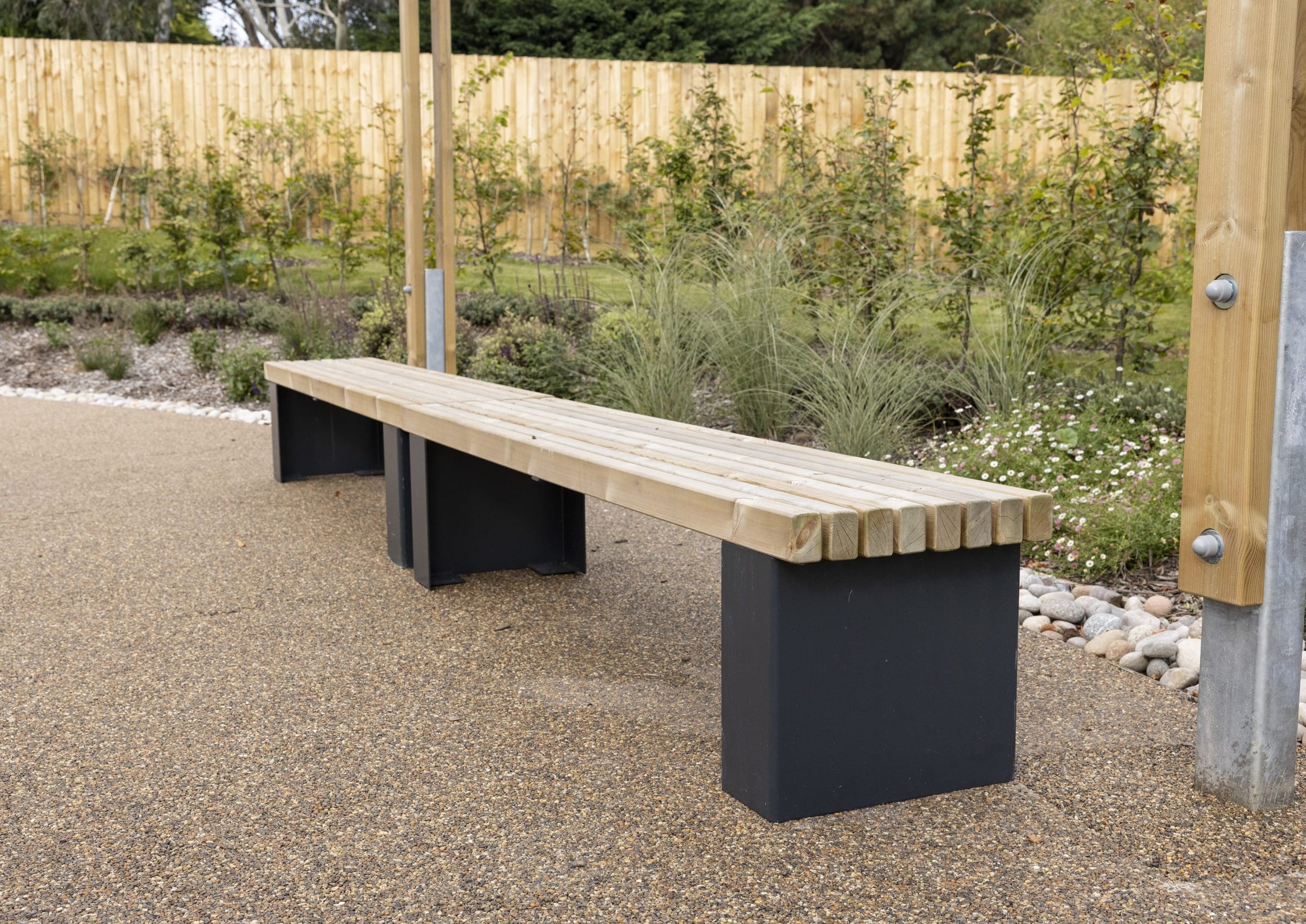 Wooden benches with black plinth legs