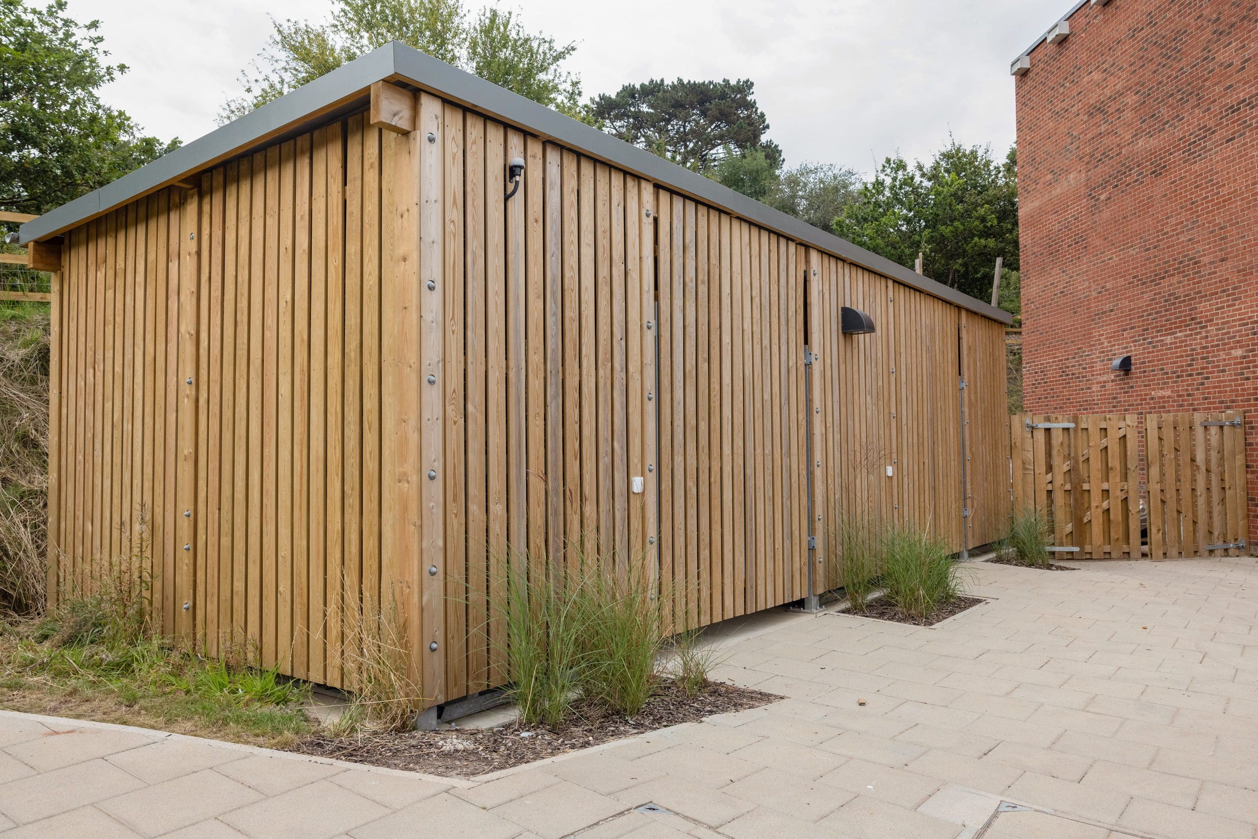 large wooden external cycle and bin storage unit