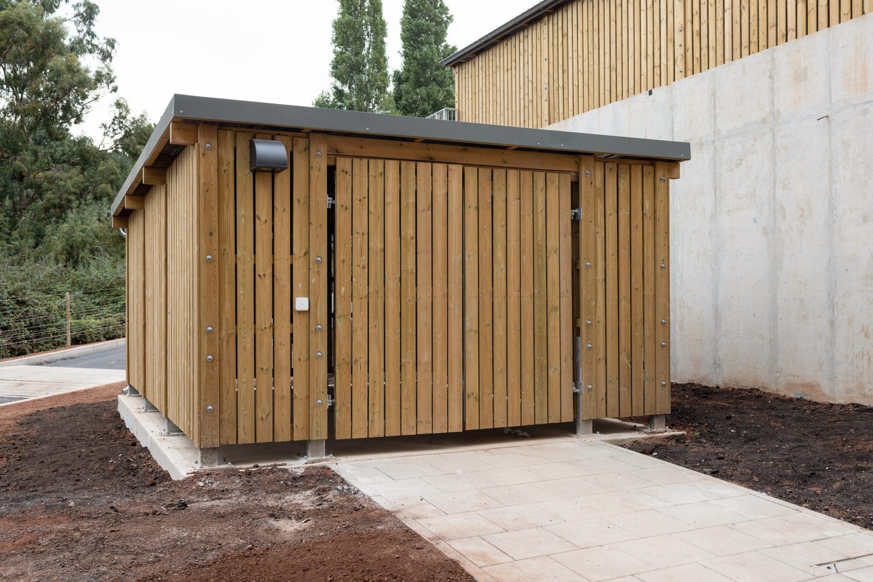 large wooden external cycle and bin storage unit