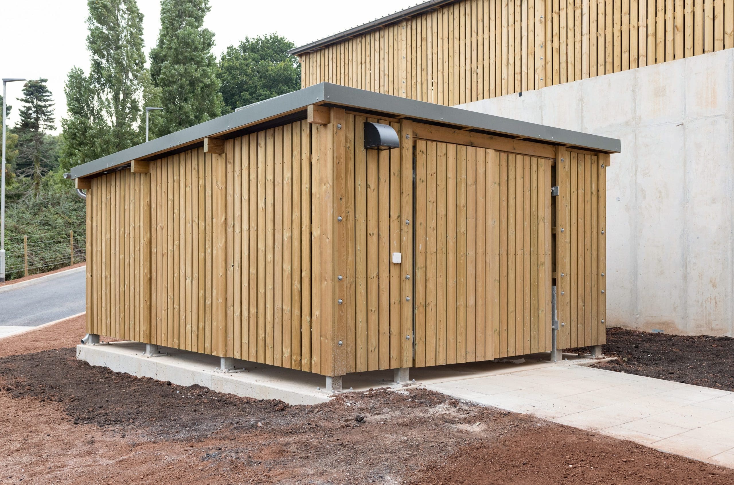 large wooden external cycle and bin storage unit