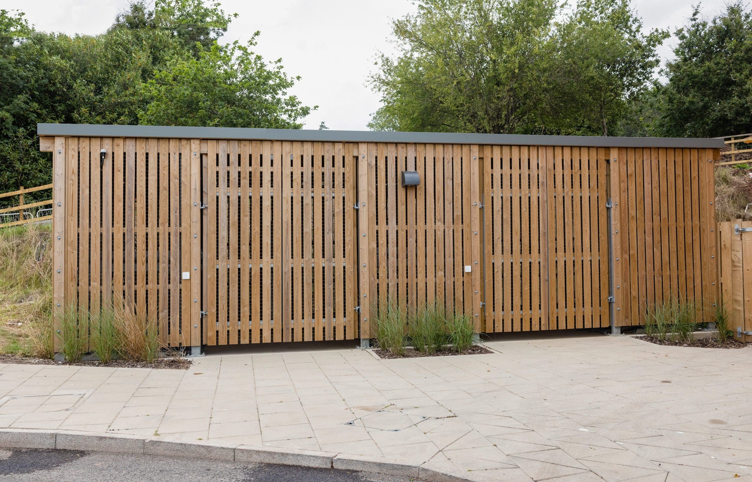large wooden external cycle and bin storage unit