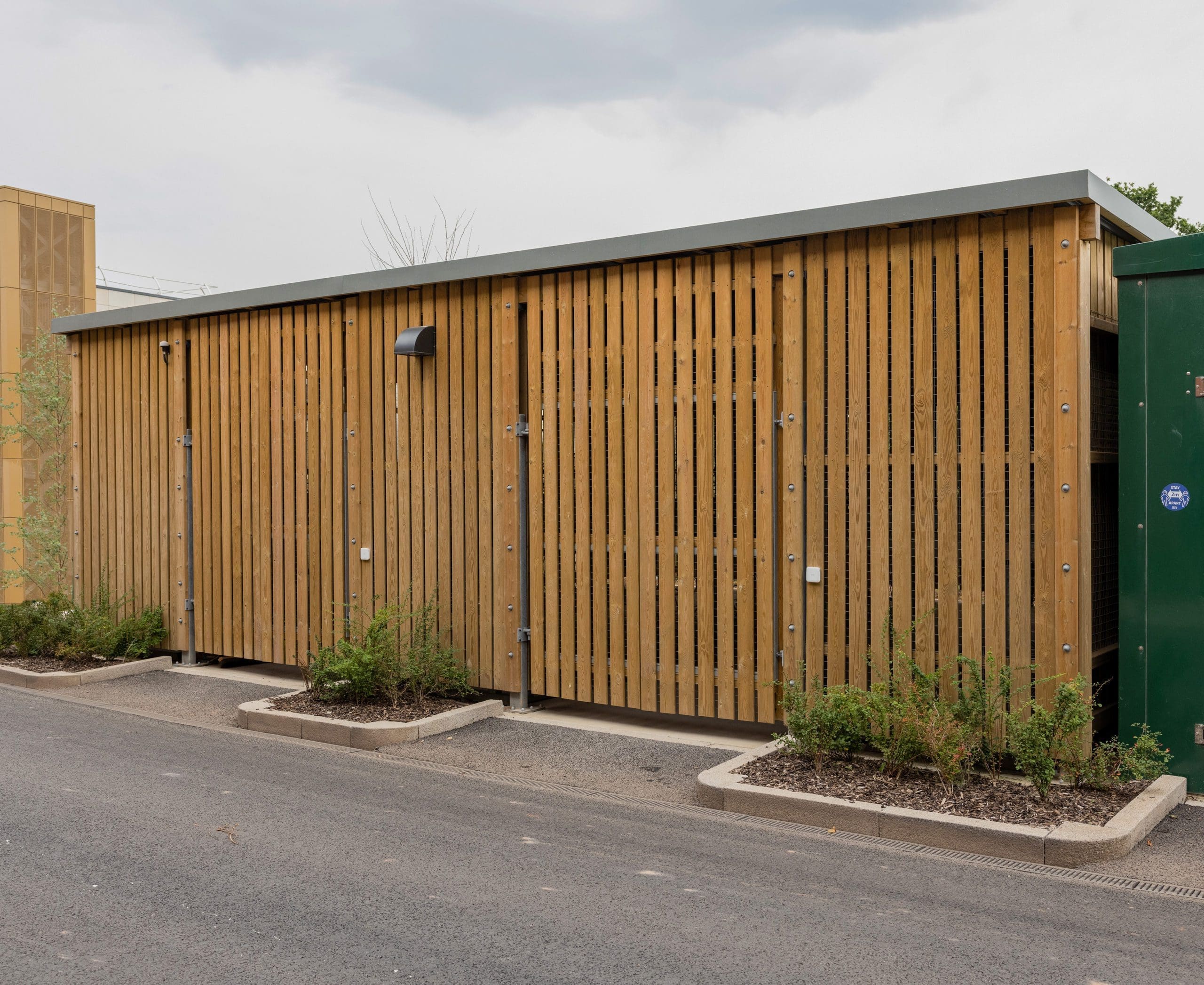 large wooden external cycle and bin storage unit