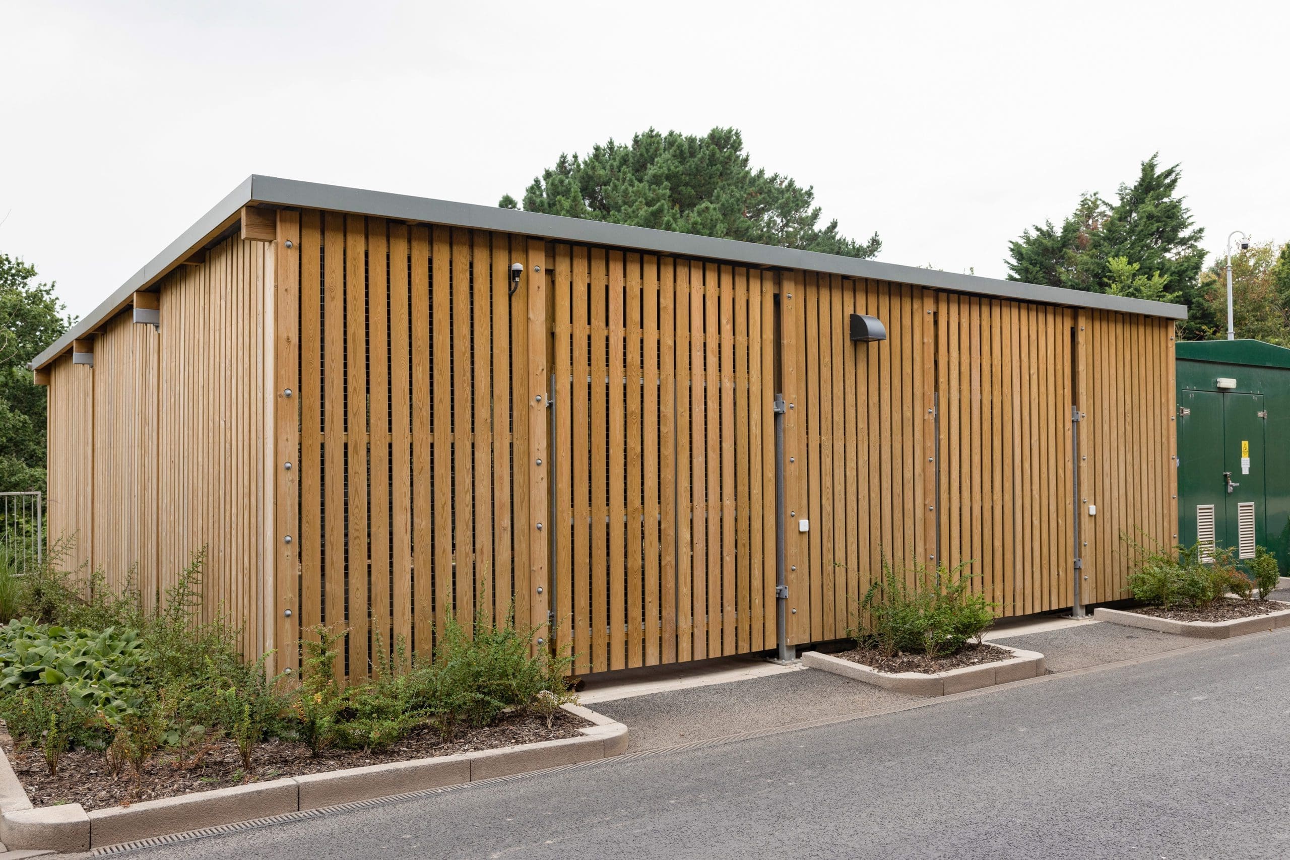 large wooden external cycle and bin storage unit