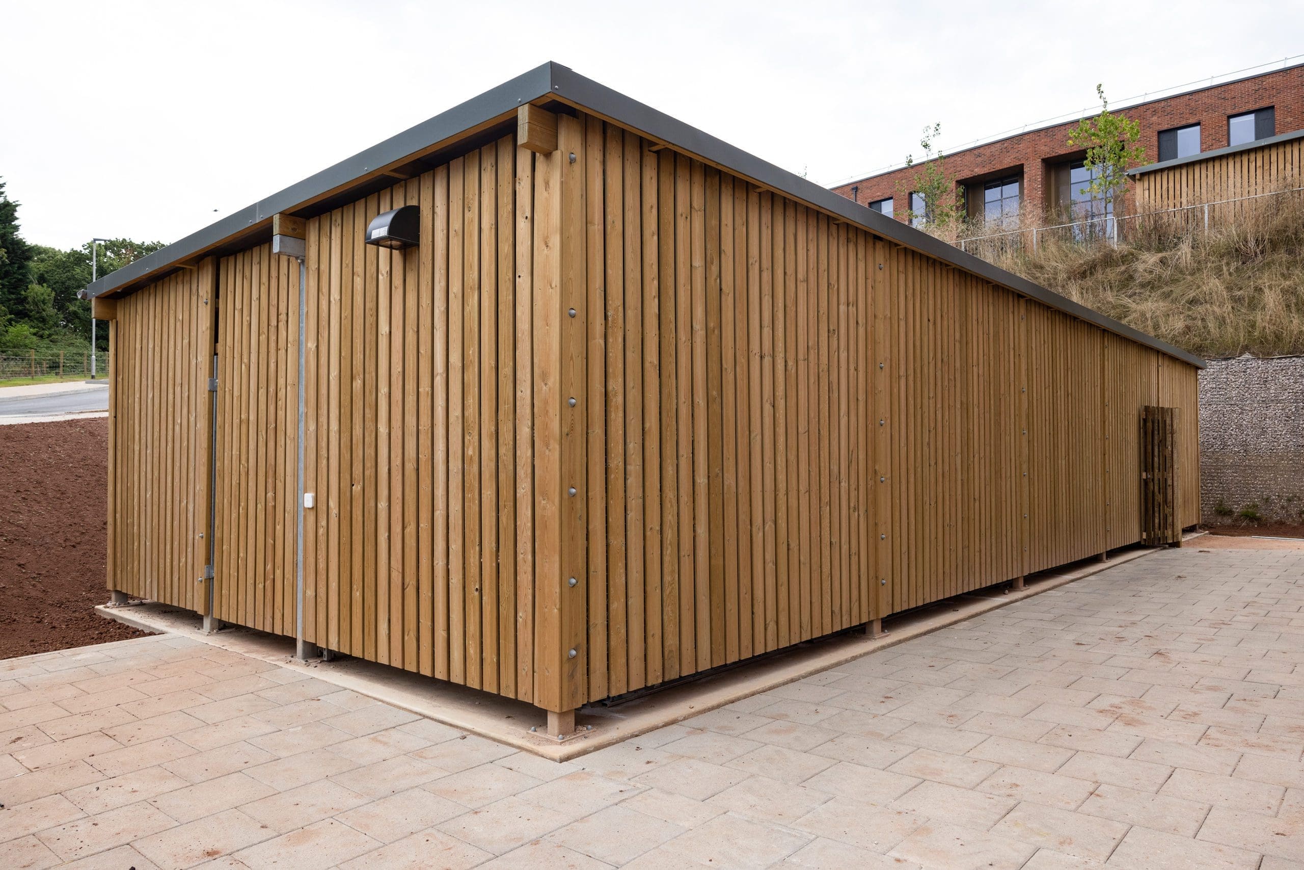 large wooden external cycle and bin storage unit