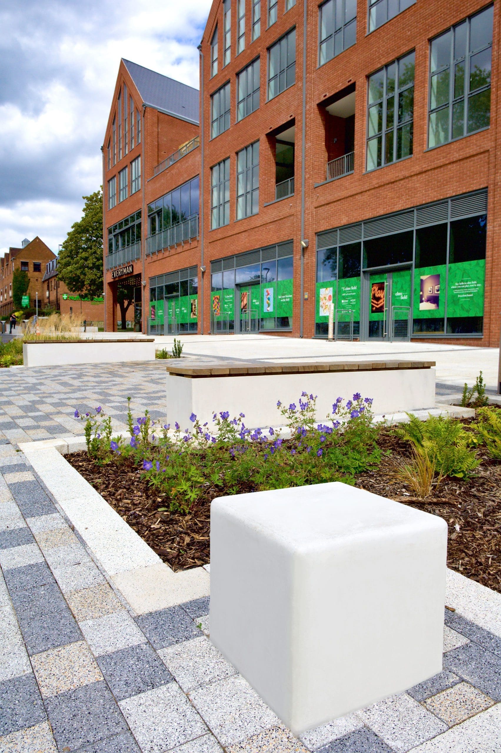 Mockup of concrete cube single seat infront of public building