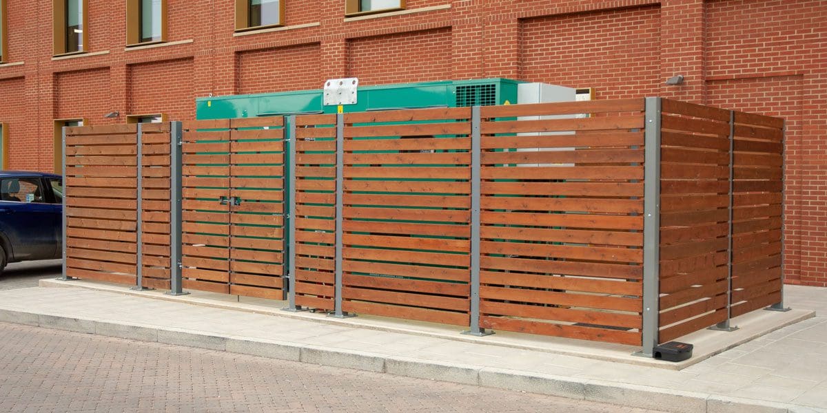 External wooden slatted protection container around electrical unit
