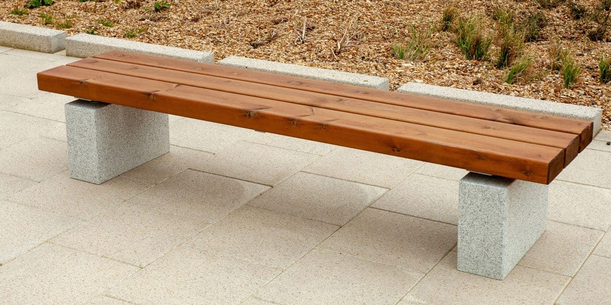 External wooden bench with concrete plinth legs