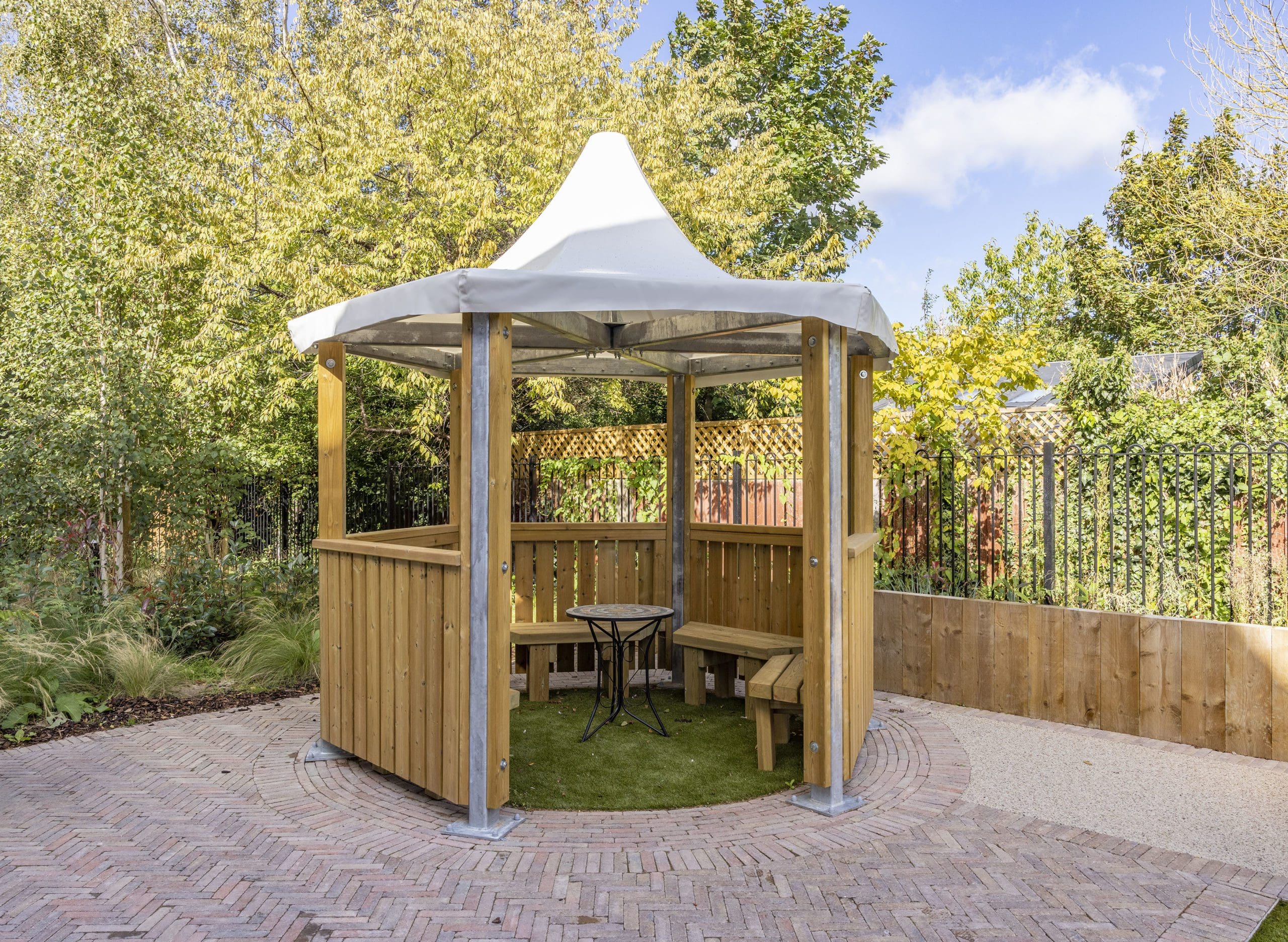 wooden hexagonal canopy with seating