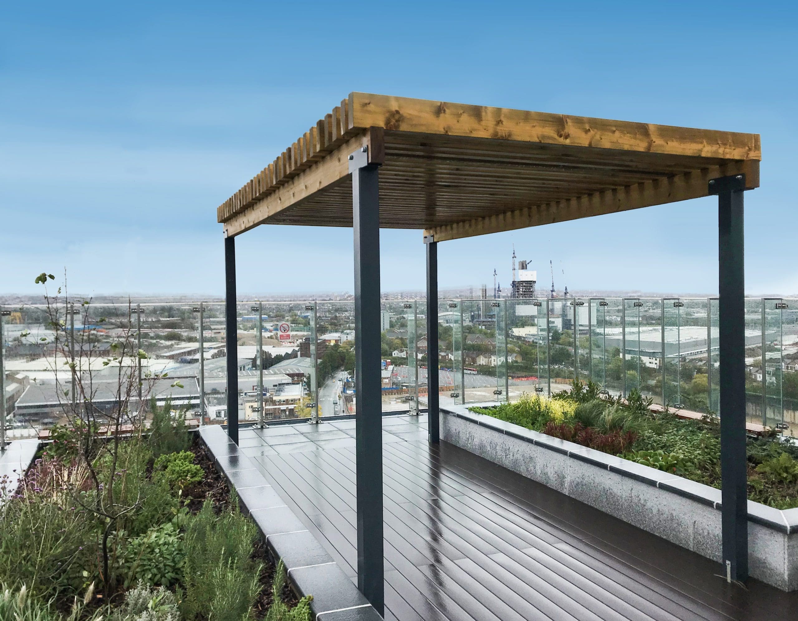Wooden and metal pergola with large raised planters left and right