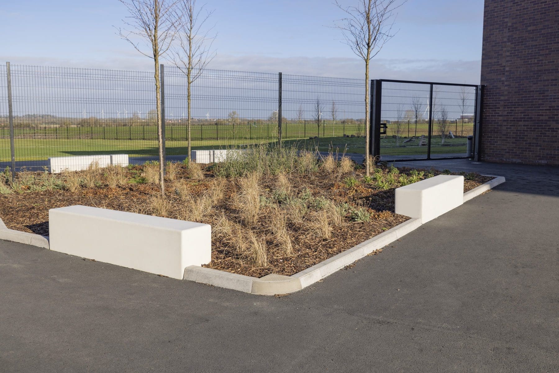 concrete benches surrounding shrubbery