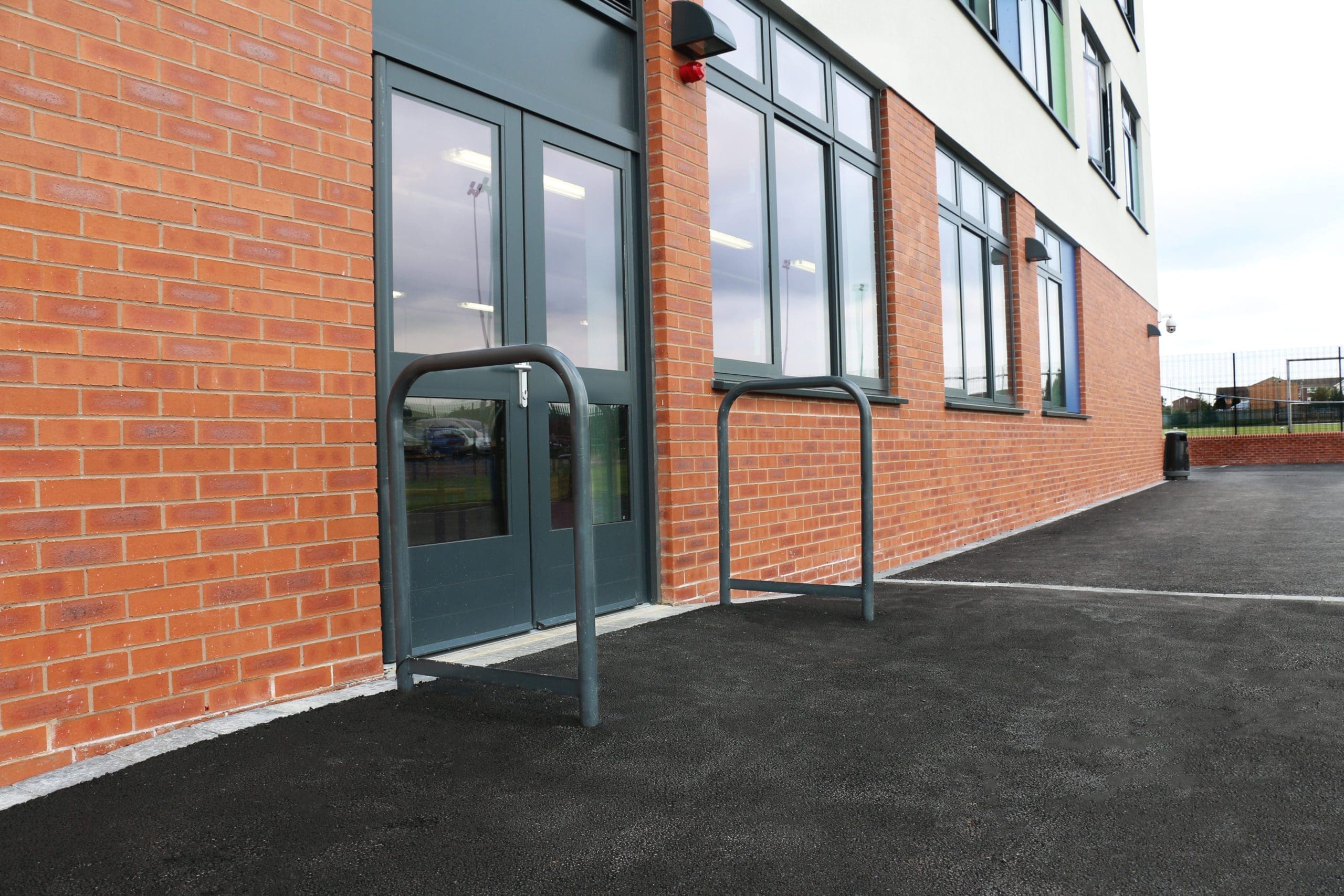Exterior metal door barrier hoops