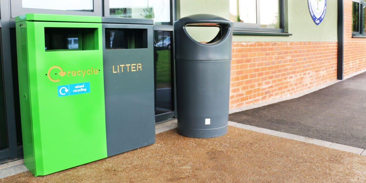 Outdoor split green and black metal recycle and litter bin
