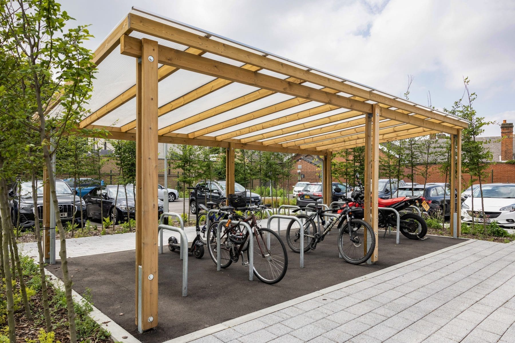 exterior-pergola-bike-storage-metal-curved-rings-in-the-ground