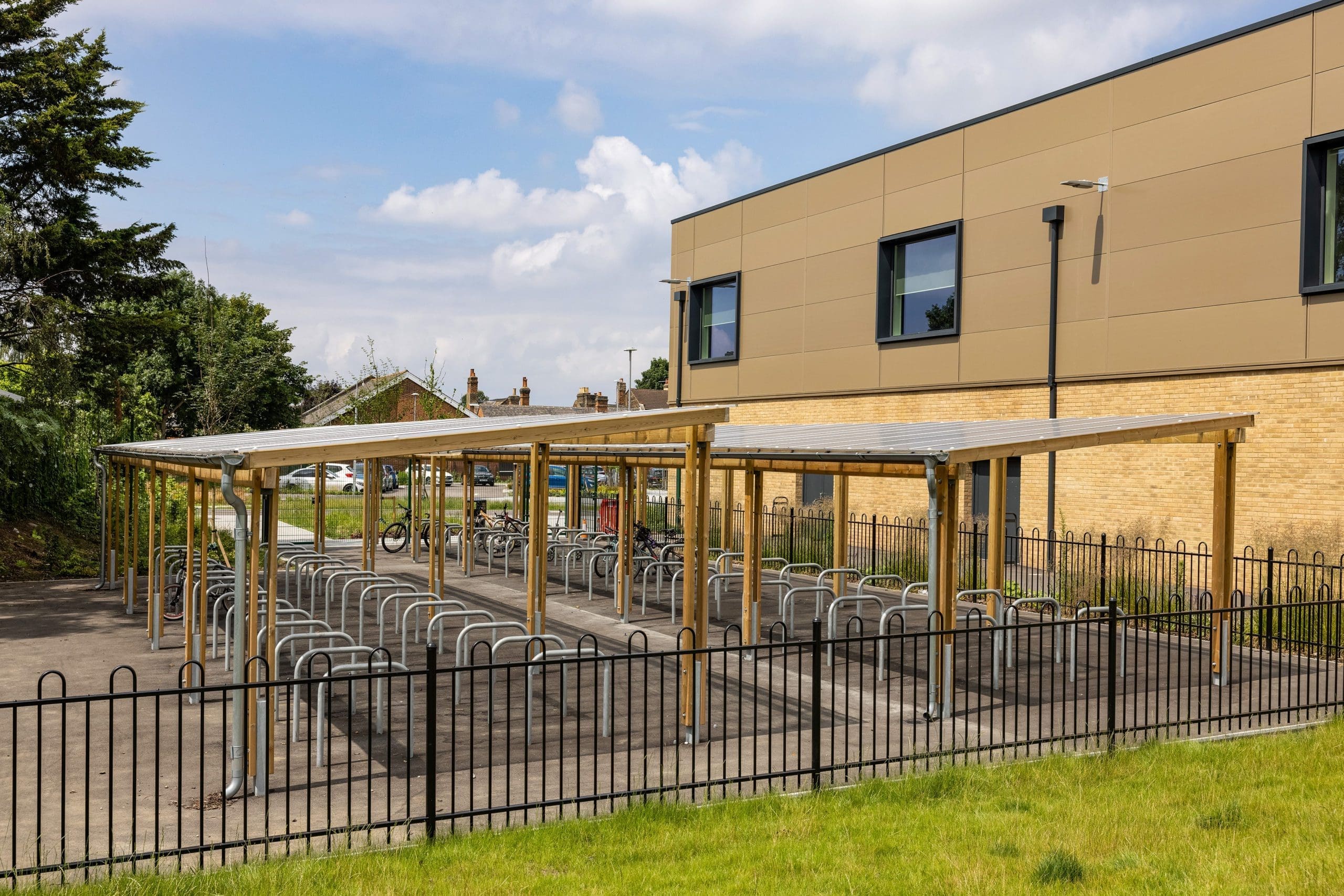 exterior-pergola-bike-storage-metal-curved-rings-in-the-ground