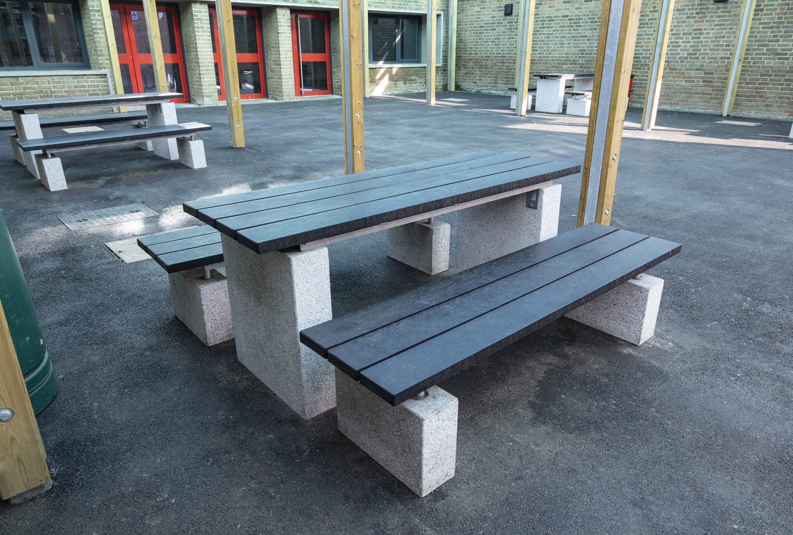 exterior-concrete-bench-and-tables-with-black-wooden-tops