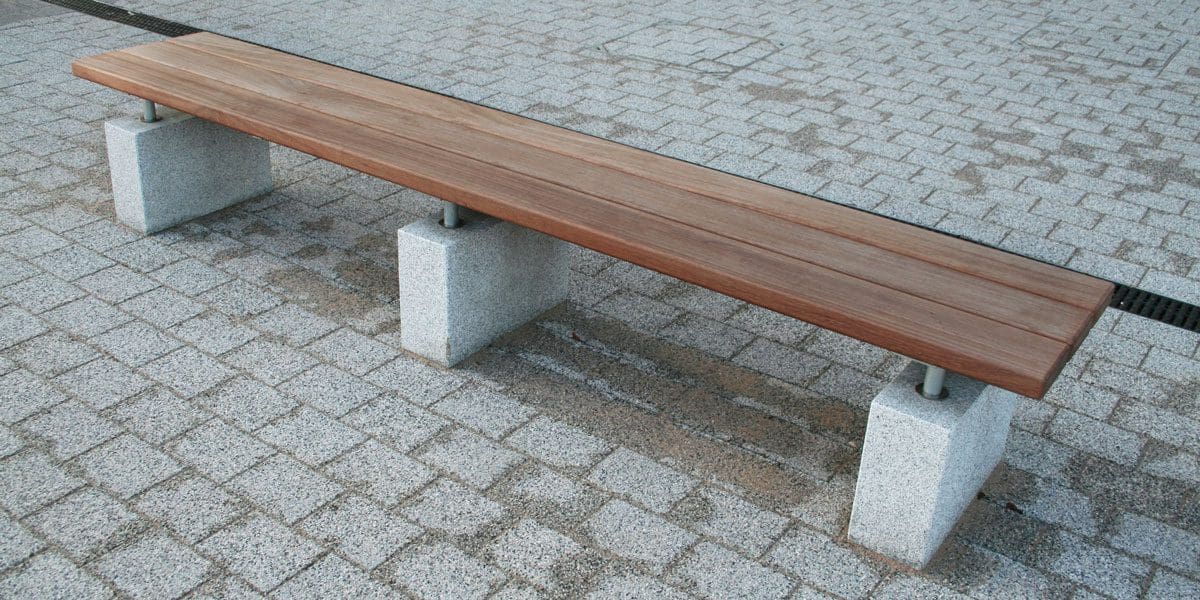 Outdoor wooden benches with concrete plinth legs