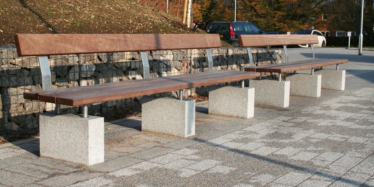 Outdoor wooden benches with concrete plinth legs