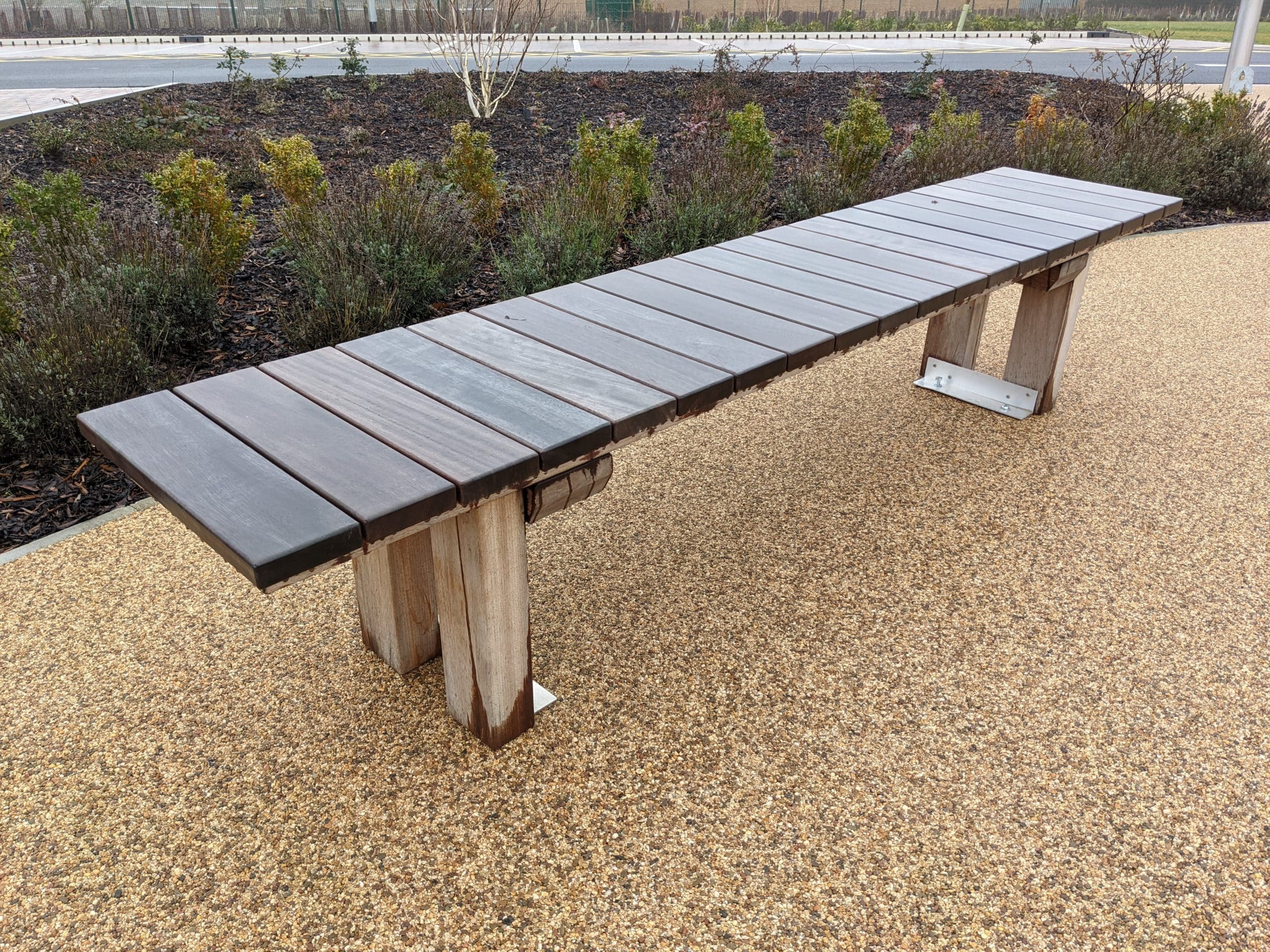 Outdoor wooden bench with wooden legs