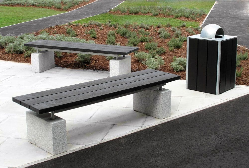 Black wooden bench with concrete plinth legs