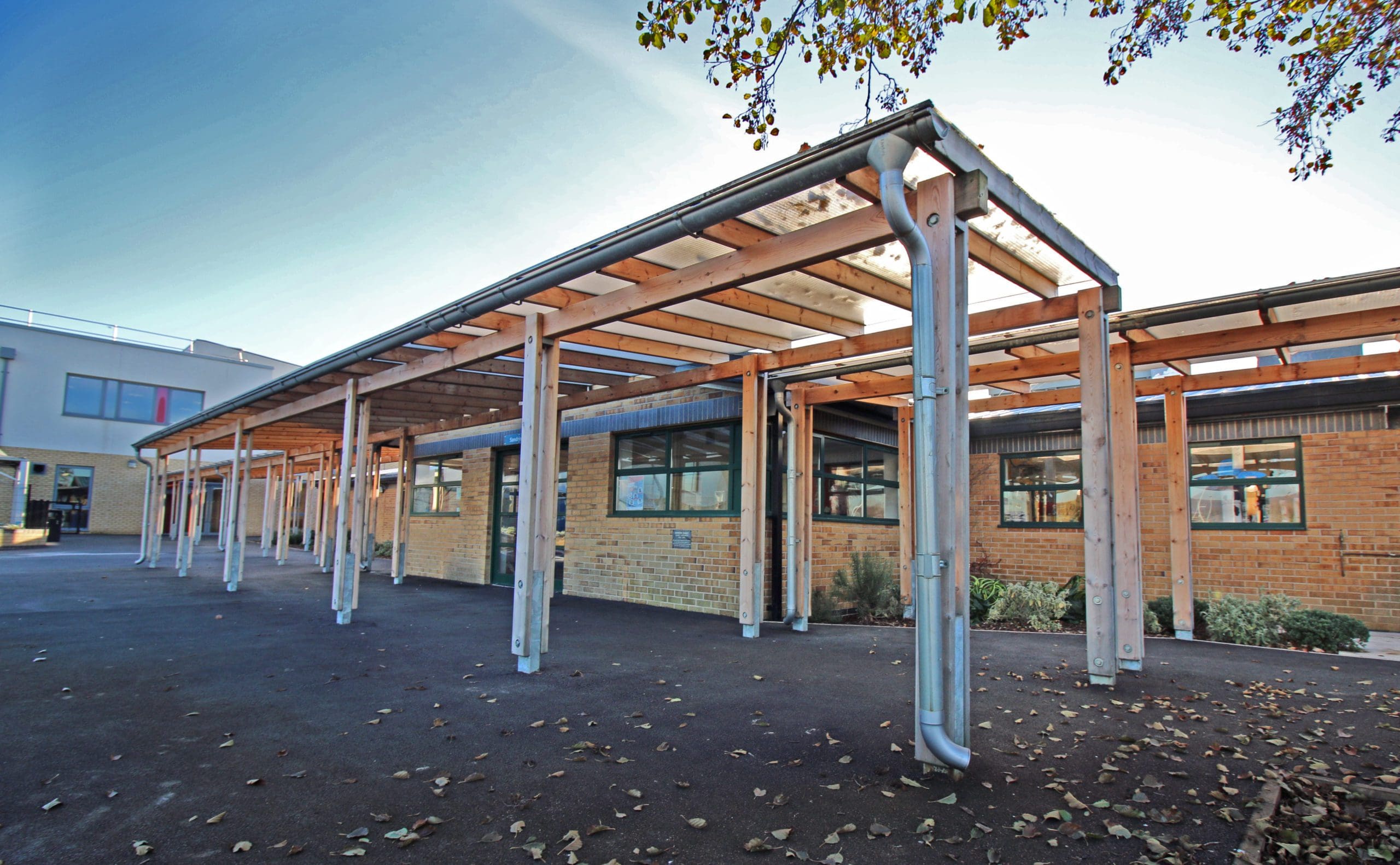Exterior wooden pergola canopy with metal drainage