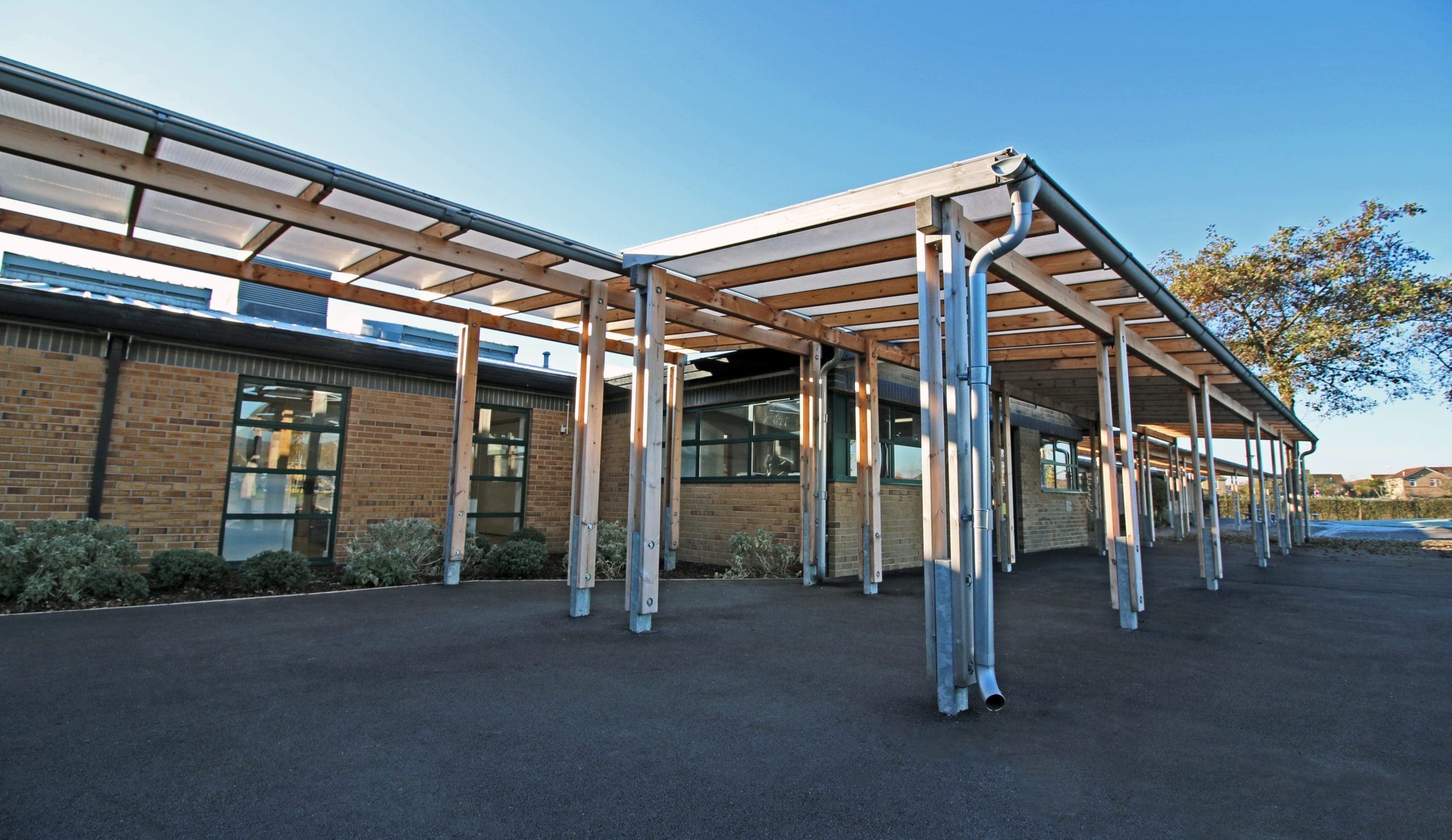 Exterior wooden pergola canopy with metal drainage