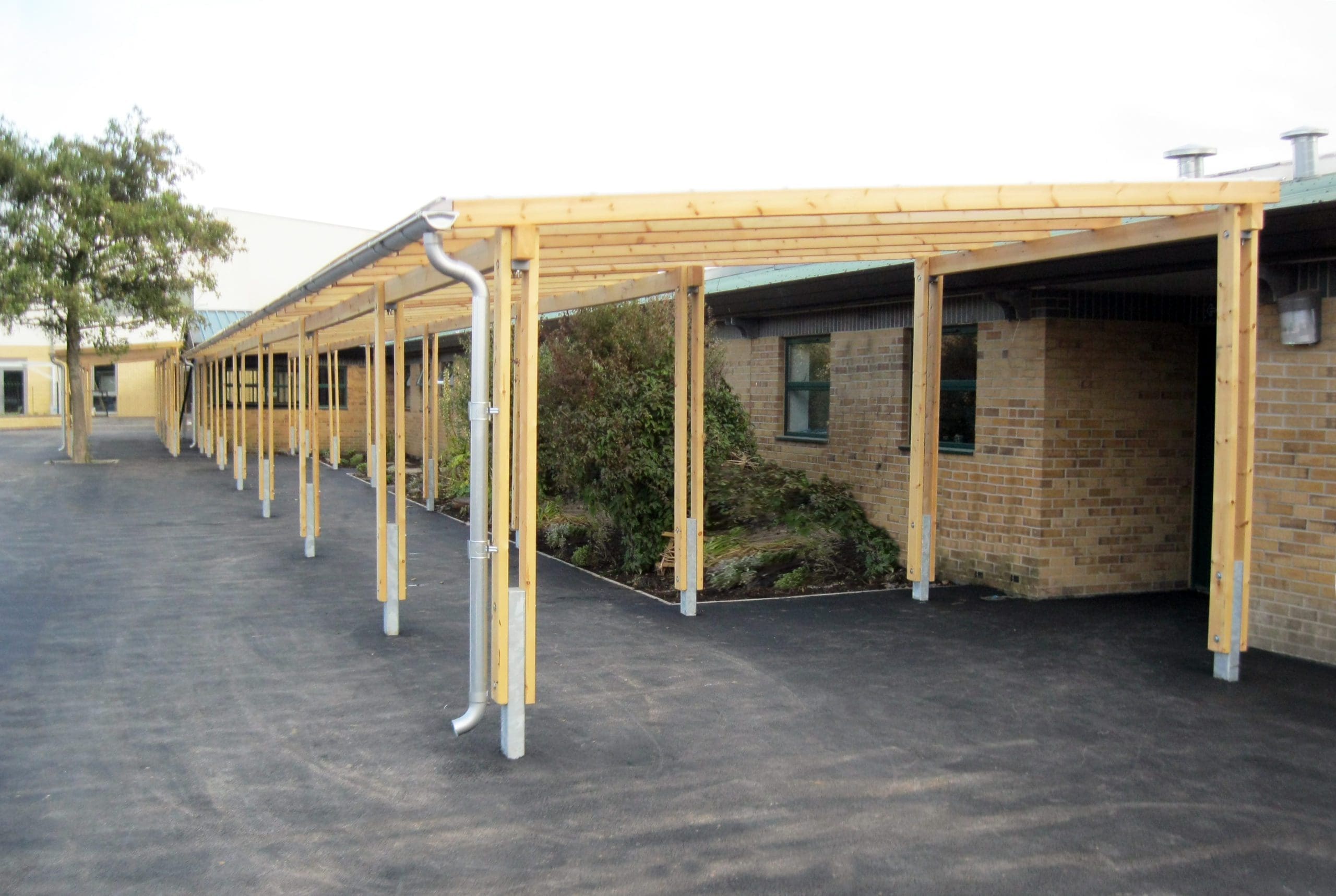Exterior wooden pergola canopy with metal drainage
