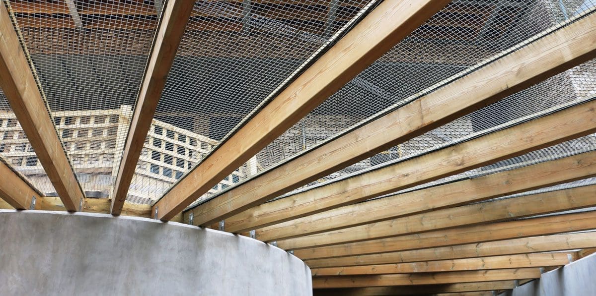 Close up of wooden circular car park entrance roofing