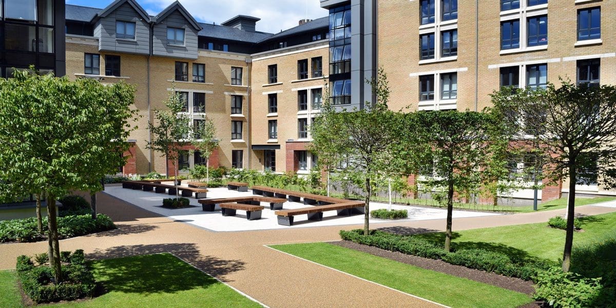 Wide shot of university showing courtyard angular seating area