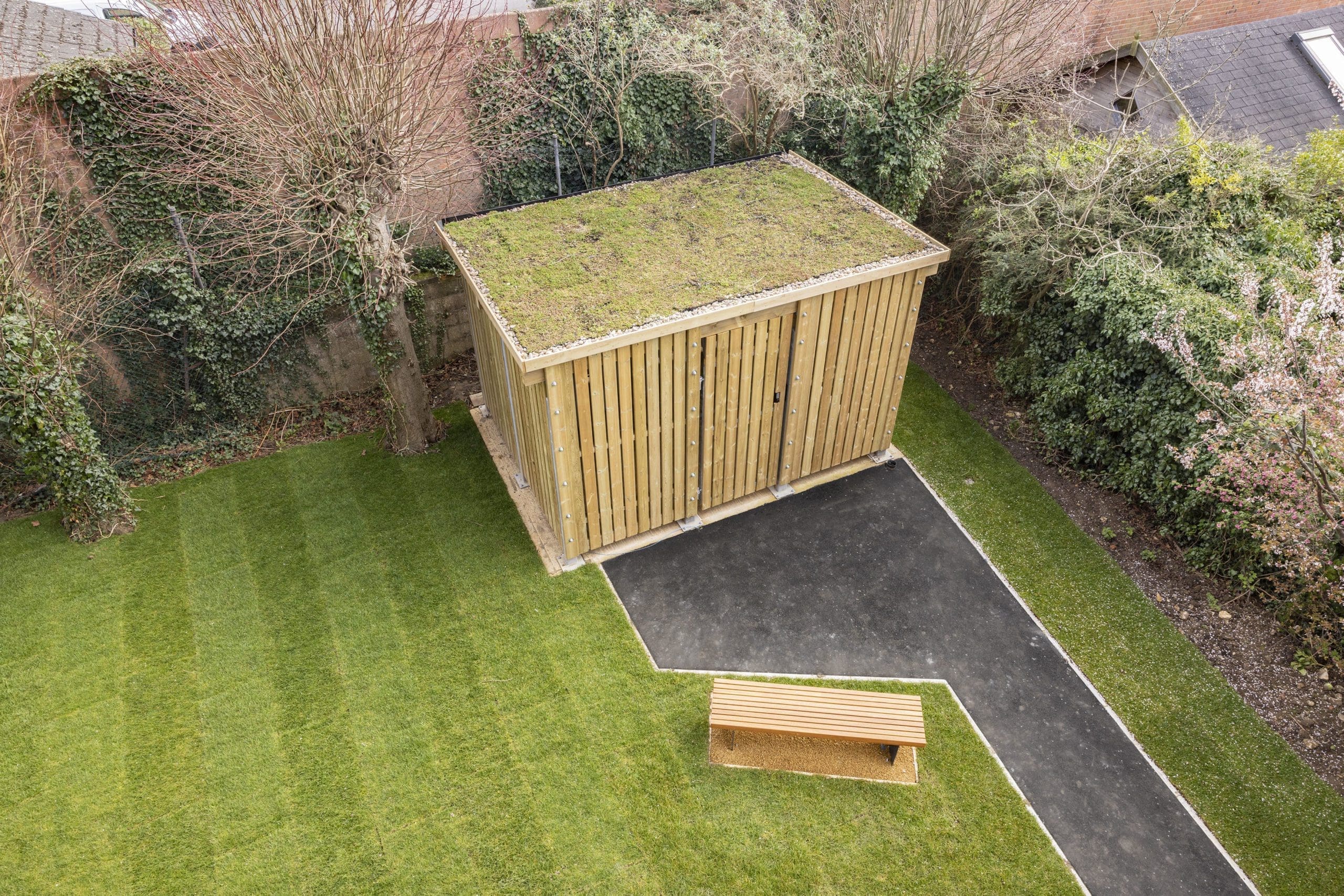 birdseye-view-exterior-cycle-shelter-with-living-roof-with-wooden-bench-outside