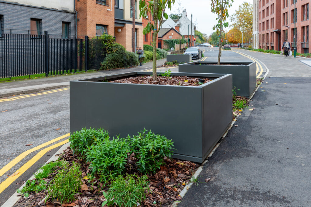 Large square tree planters made from galvanised powder coated steel were added to Morriss House as part of the development of their outside space.