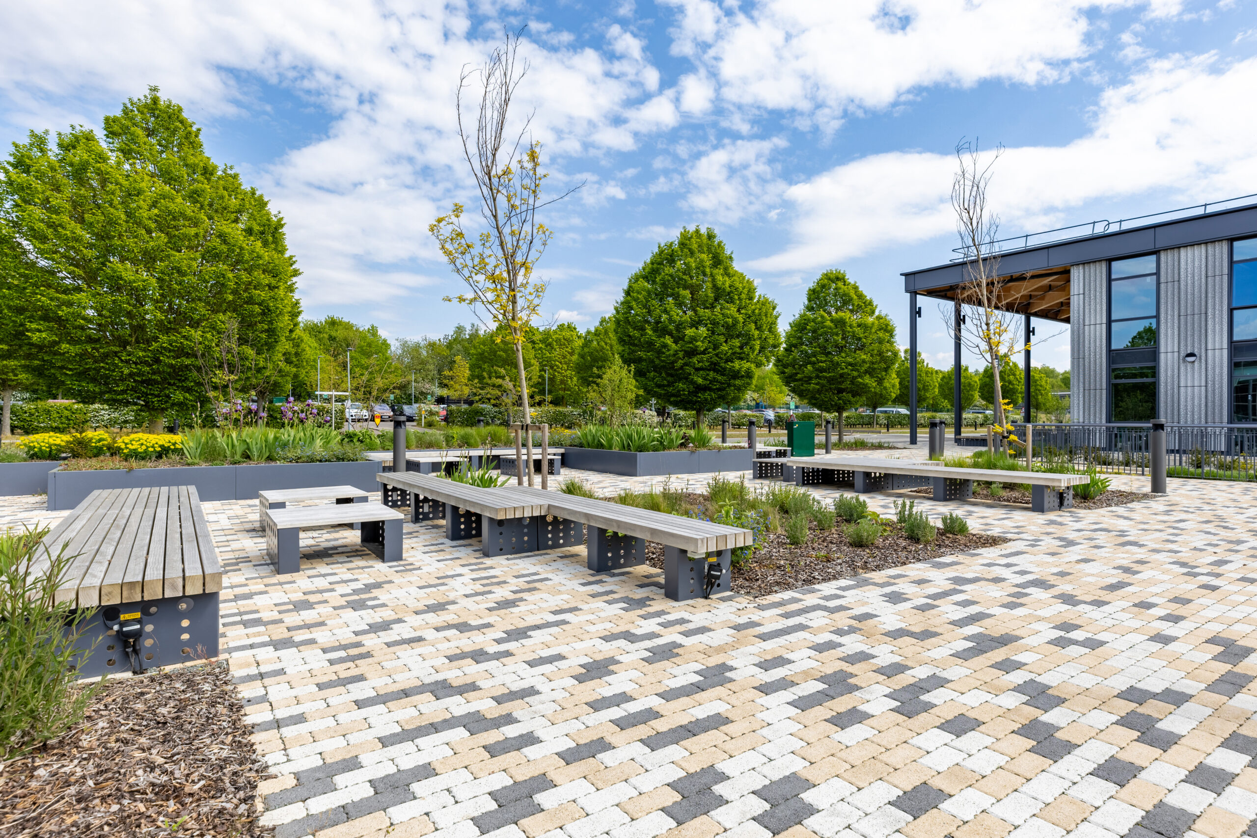 Thornton Building – bespoke planters and integrated Accoya timber seating transform this outdoor space