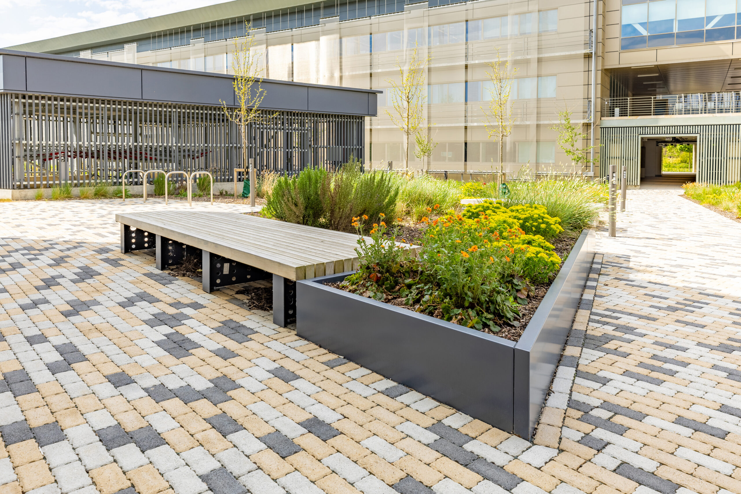 steel planters and integrated accoya seating